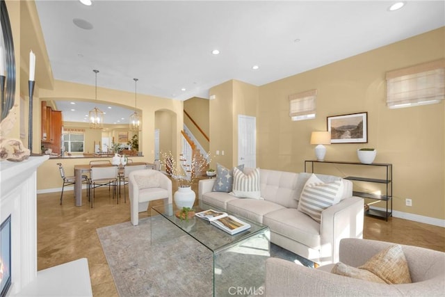 living room with a notable chandelier