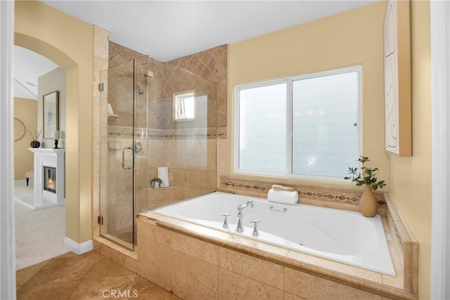 bathroom featuring separate shower and tub and tile patterned flooring