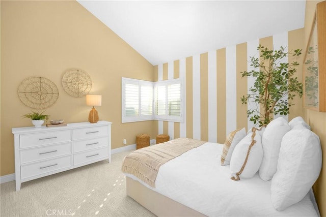 bedroom featuring light carpet and vaulted ceiling