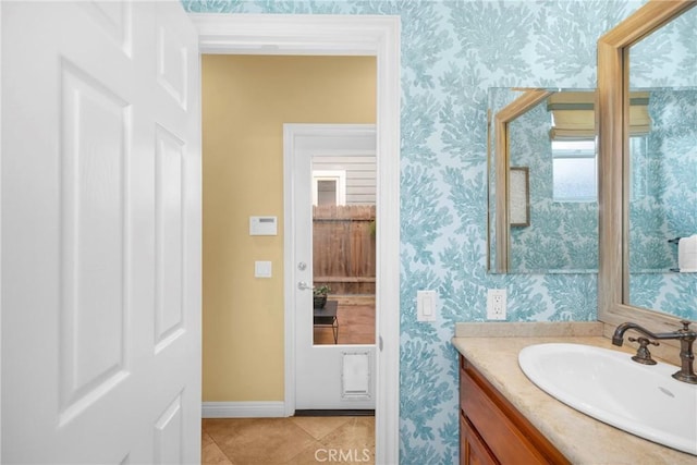 bathroom featuring tile patterned flooring and vanity