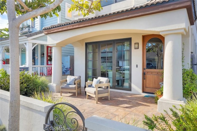 doorway to property with covered porch