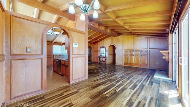 bonus room with vaulted ceiling with beams, a chandelier, wood finished floors, arched walkways, and a decorative wall