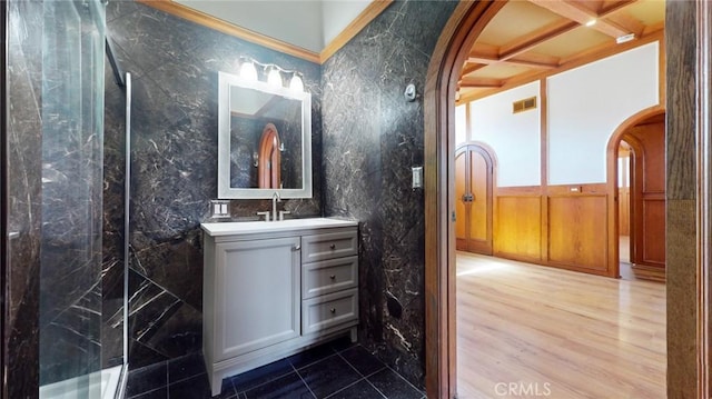 full bath featuring vanity, wood finished floors, visible vents, coffered ceiling, and a shower