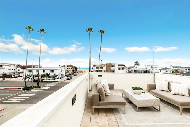 exterior space featuring an outdoor living space and a water view