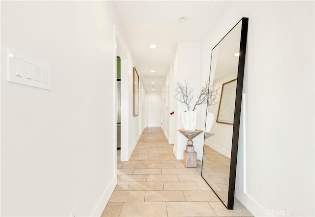 hallway with light tile patterned floors