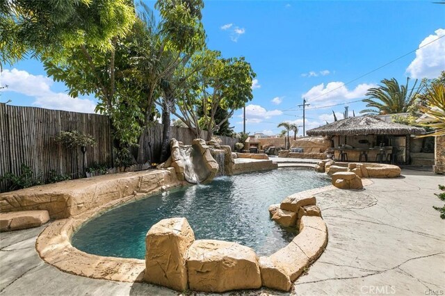 view of pool featuring a patio and pool water feature