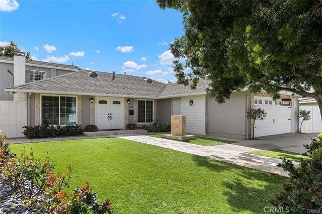 single story home with a garage and a front yard