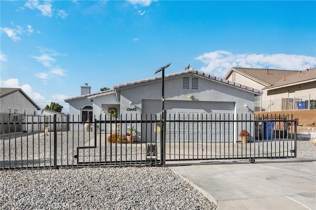 view of gate with a garage