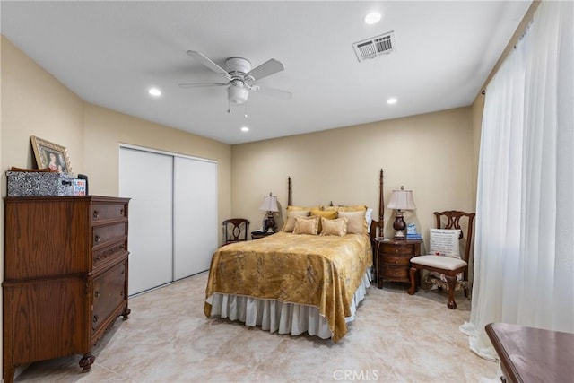 bedroom featuring ceiling fan and a closet