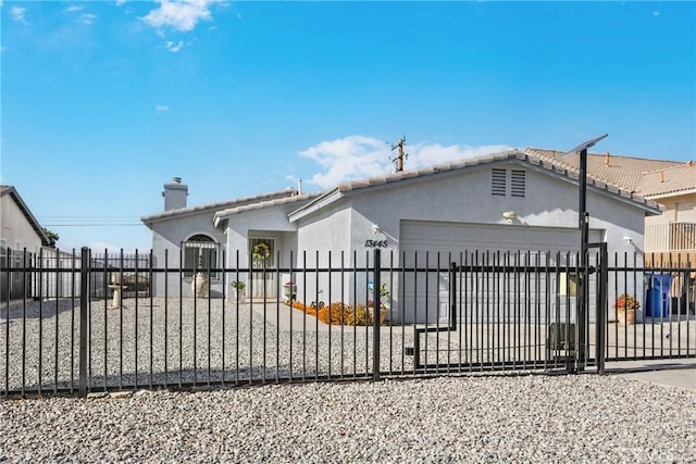 view of gate with a garage