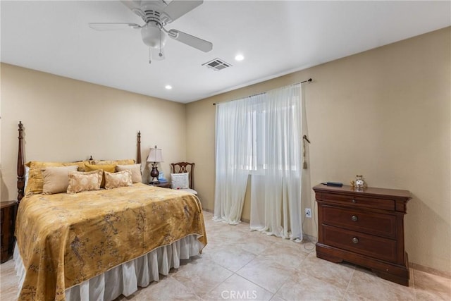 tiled bedroom featuring ceiling fan