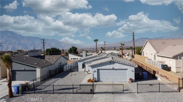 birds eye view of property with a mountain view