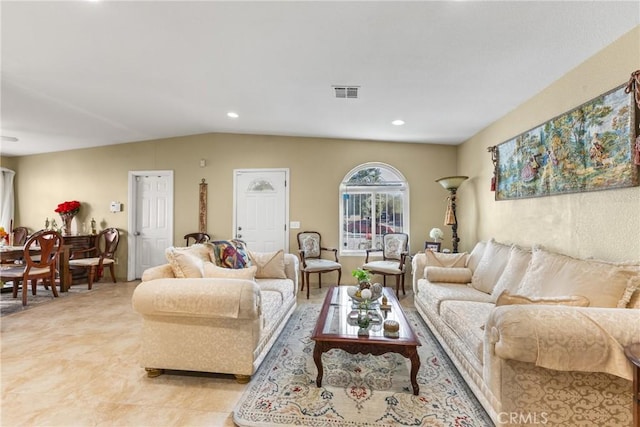 tiled living room featuring vaulted ceiling