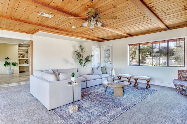 living room featuring beamed ceiling, carpet flooring, and wood ceiling