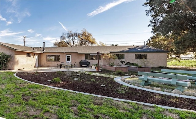 rear view of property with a patio area