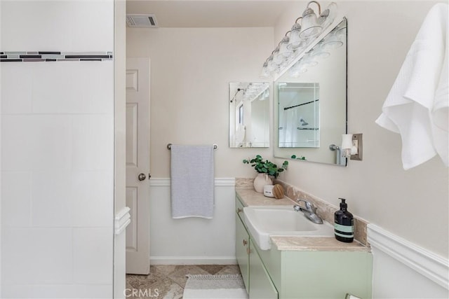 bathroom with tile patterned floors and vanity