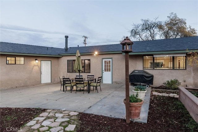 back of house with a patio