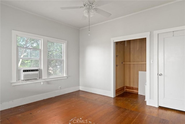 unfurnished bedroom featuring cooling unit, ceiling fan, ornamental molding, and dark hardwood / wood-style flooring