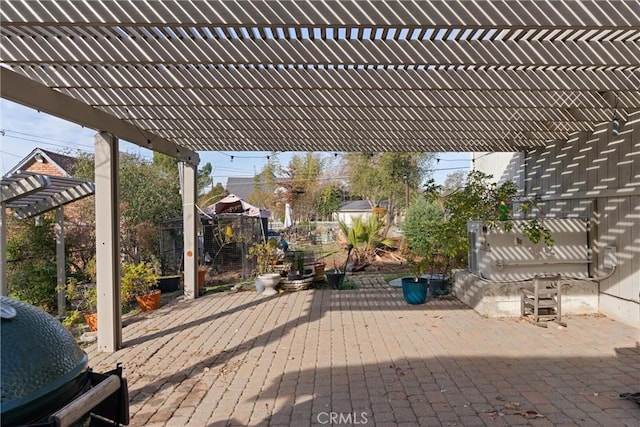 view of patio featuring area for grilling and a pergola