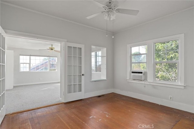 unfurnished room with crown molding, ceiling fan, cooling unit, hardwood / wood-style floors, and french doors