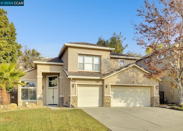 view of front facade with a garage and a front yard