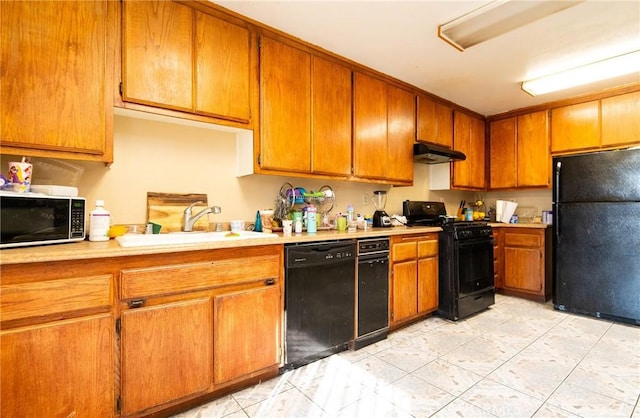 kitchen with sink and black appliances