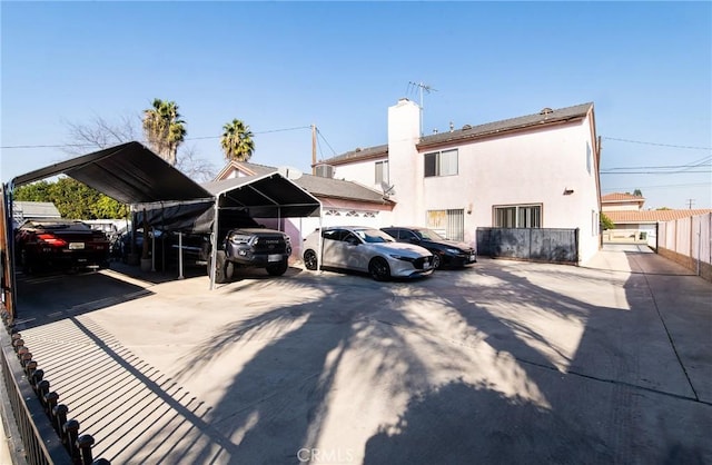 view of parking with a carport