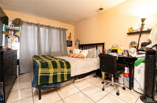 bedroom featuring light tile patterned floors