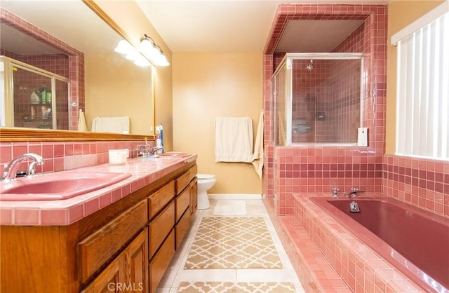 full bathroom featuring tile patterned floors, vanity, independent shower and bath, and toilet