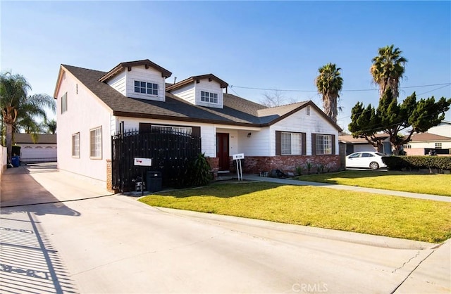 view of front of home with a garage and a front lawn