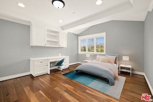 bedroom featuring ornamental molding, dark hardwood / wood-style flooring, vaulted ceiling, and built in desk