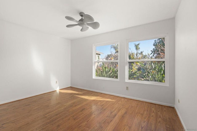 empty room featuring ceiling fan and wood-type flooring