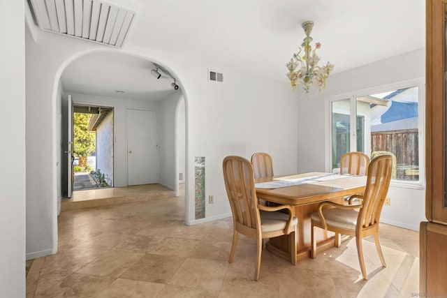 dining room featuring a notable chandelier