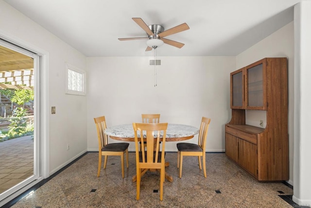 dining room featuring ceiling fan