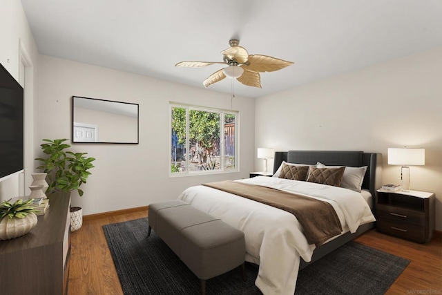 bedroom featuring ceiling fan and dark wood-type flooring