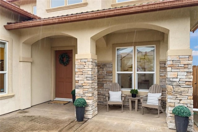 doorway to property featuring a patio area