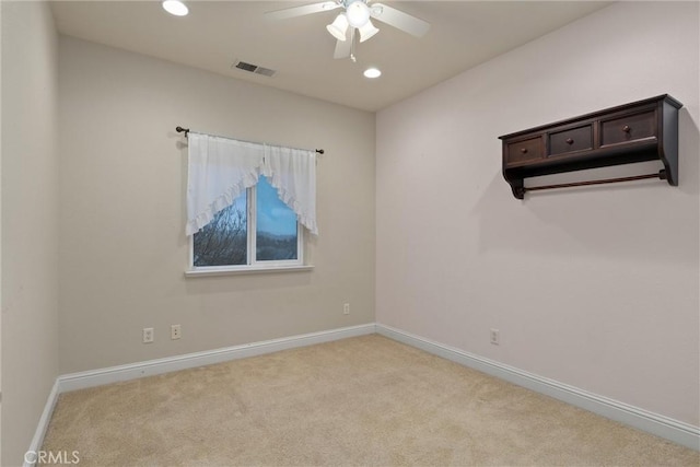 carpeted empty room with ceiling fan