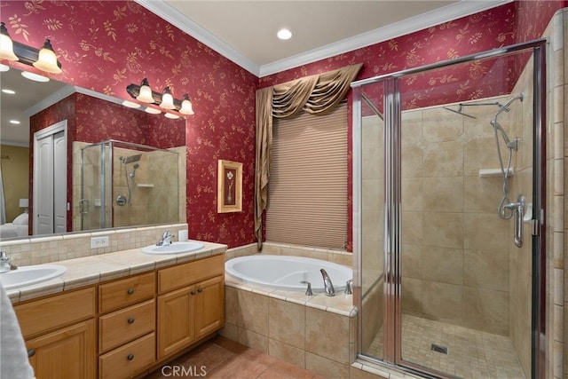 bathroom featuring vanity, independent shower and bath, and ornamental molding