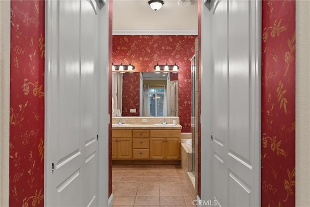 bathroom with an enclosed shower, vanity, tile patterned flooring, and ornamental molding