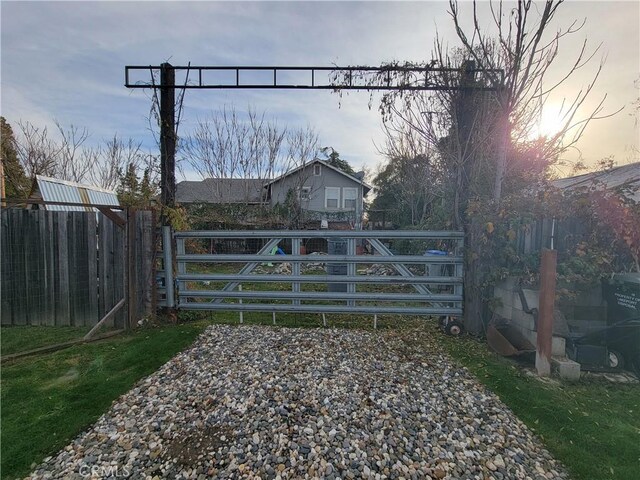 view of gate at dusk