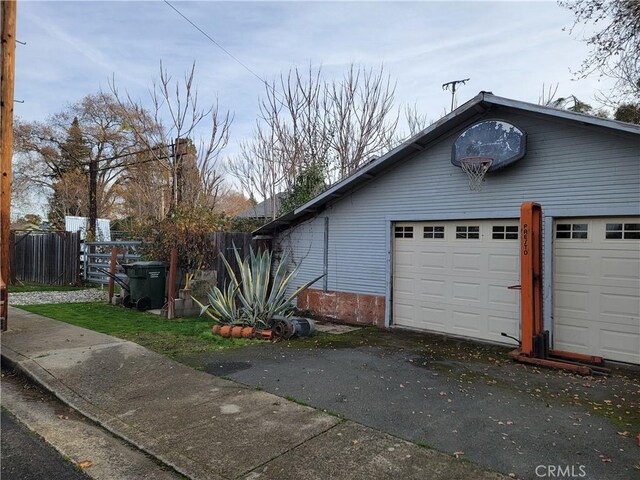 view of home's exterior featuring an outbuilding and a garage