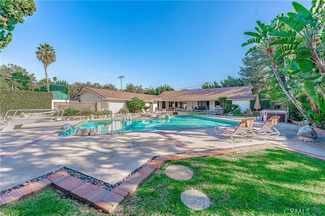 view of swimming pool with a patio