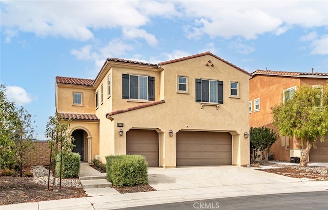 mediterranean / spanish-style house featuring a garage