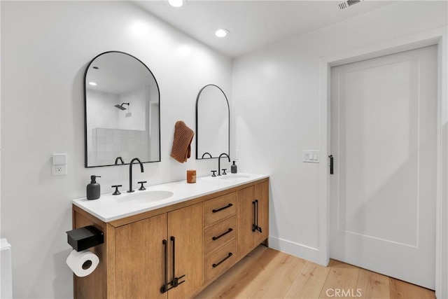 bathroom featuring hardwood / wood-style floors and vanity