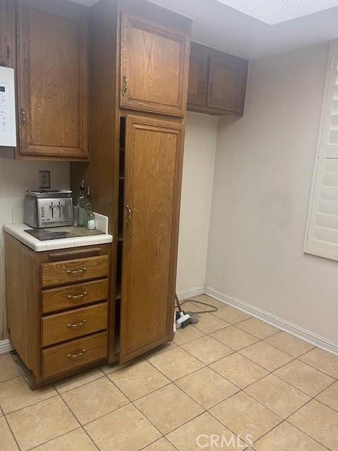 kitchen with light tile patterned floors