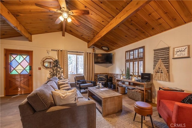 living room featuring vaulted ceiling with beams, ceiling fan, and wood ceiling