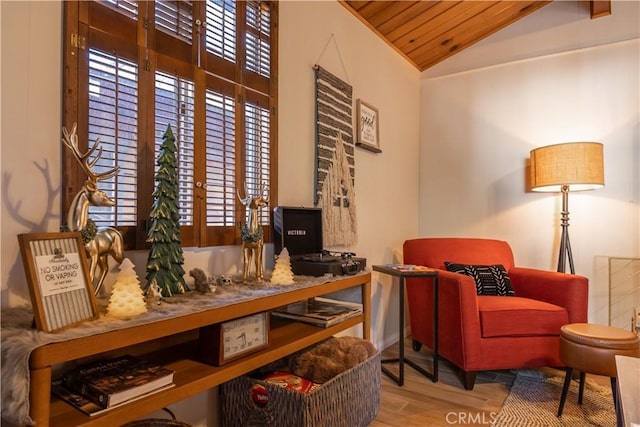 sitting room featuring wood ceiling, lofted ceiling, and light hardwood / wood-style floors