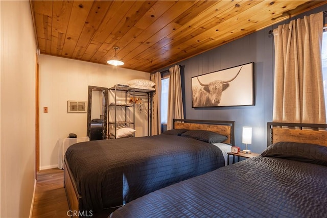 bedroom featuring wood-type flooring and wooden ceiling