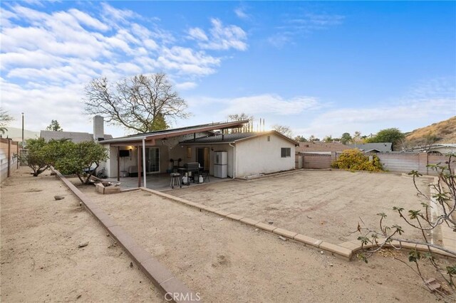 rear view of house featuring a patio area