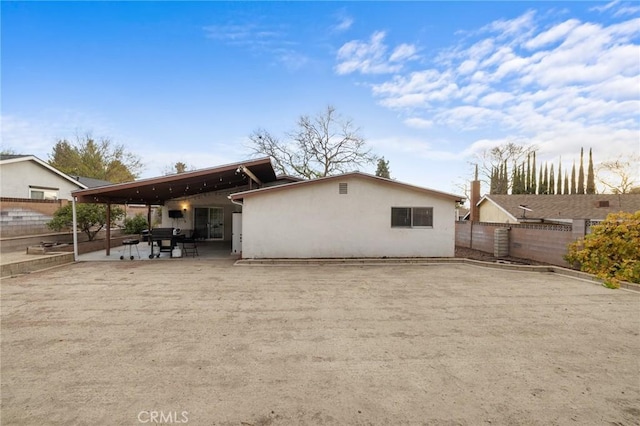 rear view of property with a patio area